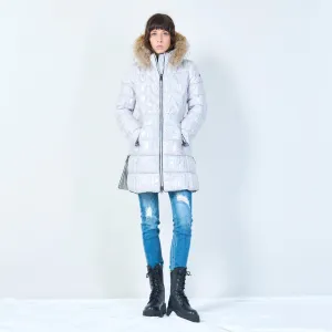 Long quilted puffer with faux fur hood wholesale