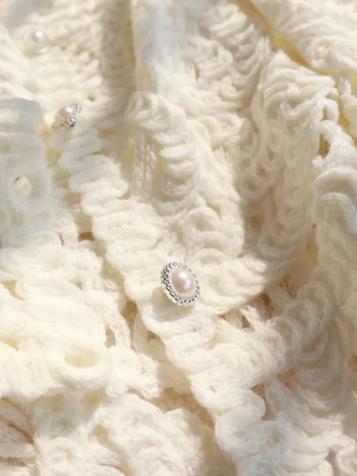 White knitted sweater